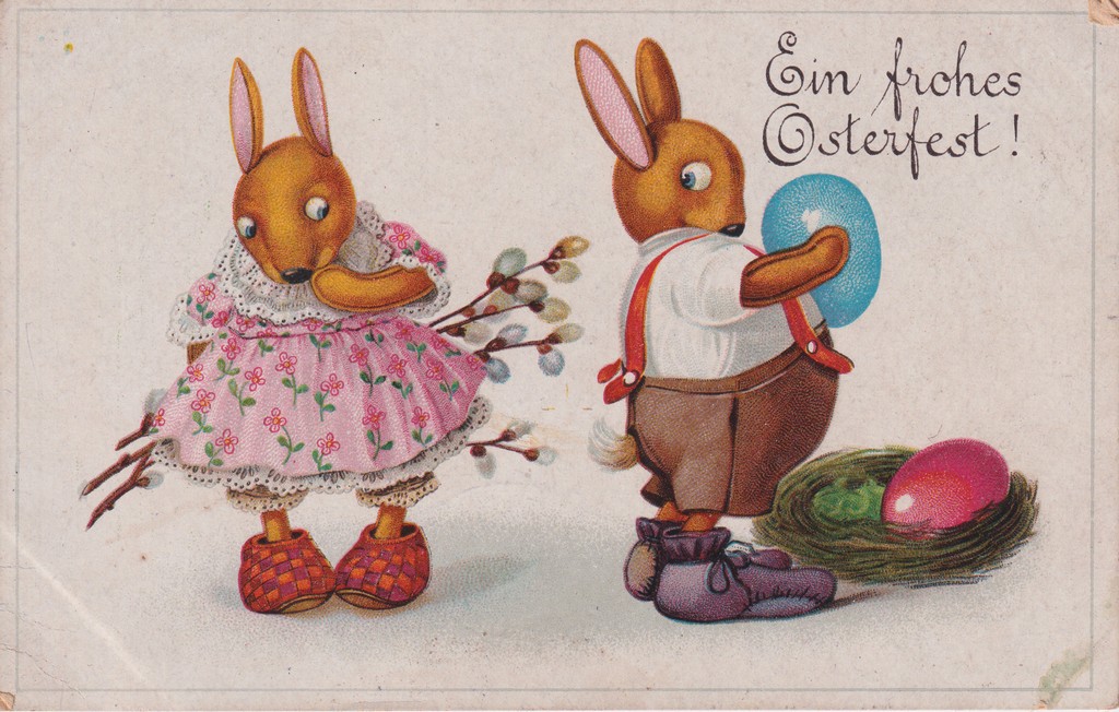 [404] Húsvéti üdvözlet, kislány nyuszi virágot tart a kezében, fiú nyuszi kék tojást tart, a kosárban van egy rózsaszin tojás , Őcsény 
